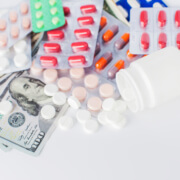 pills on currency shutterstock 4_9_2018