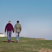 couple walking on beach for HIV image Photo by Stanley Dai, Unsplash. 11_1_2018