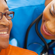 african senior patient with female nurse